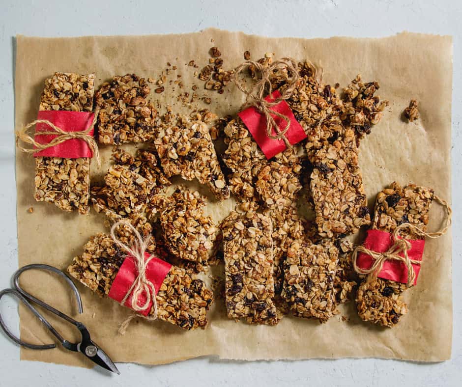 baked granola bars wrapped on top of parchment paper