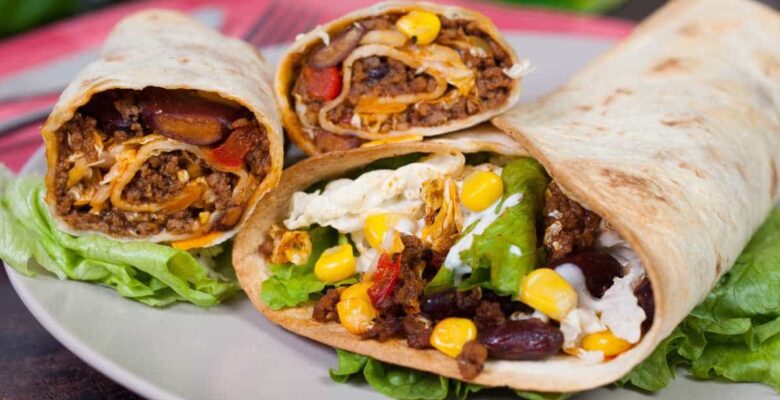 homemade flour tortillas with oil and meat, bean, and corn fillings