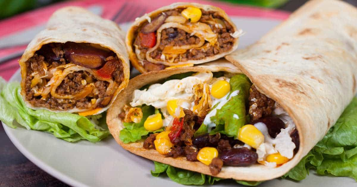 homemade flour tortillas with oil and meat, bean, and corn fillings