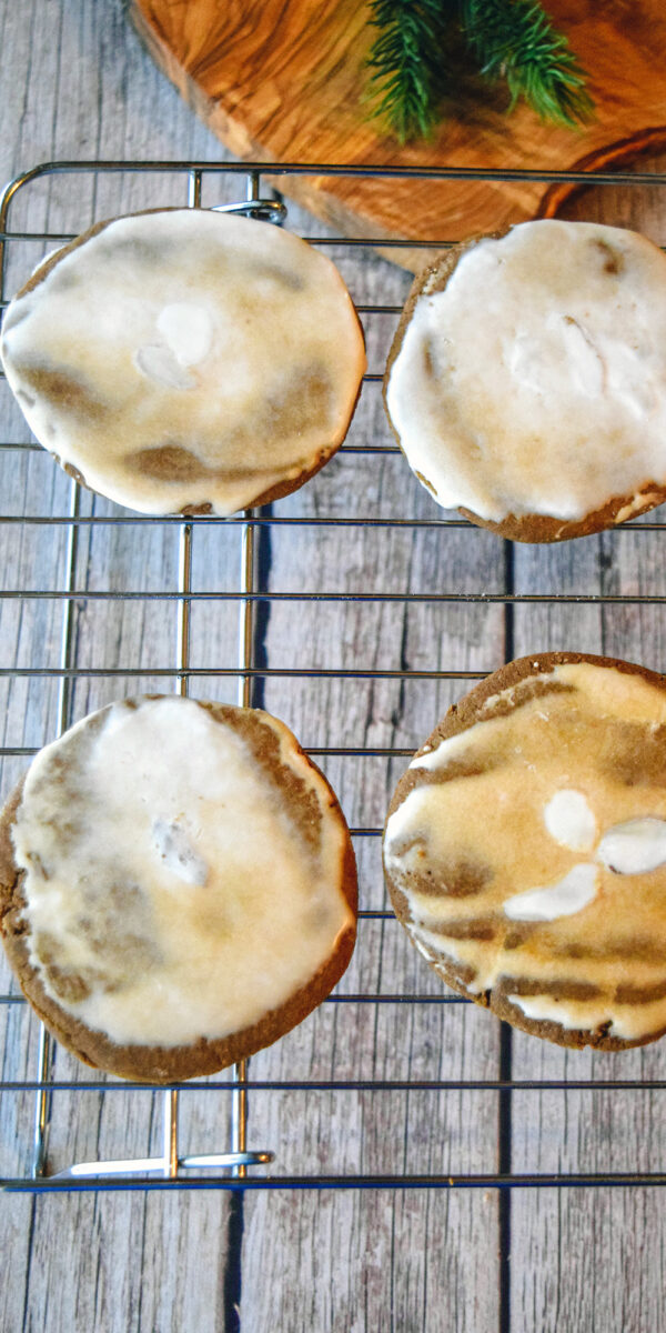 glazed spice cookies on cooling rack