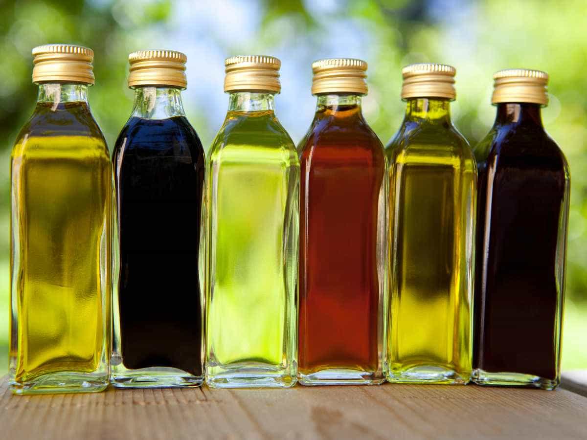 bottles of oil and vinegar for sweet vinaigrette recipe