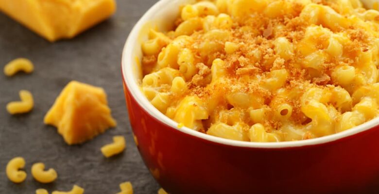 baked mac and cheese in bowl with cheese side