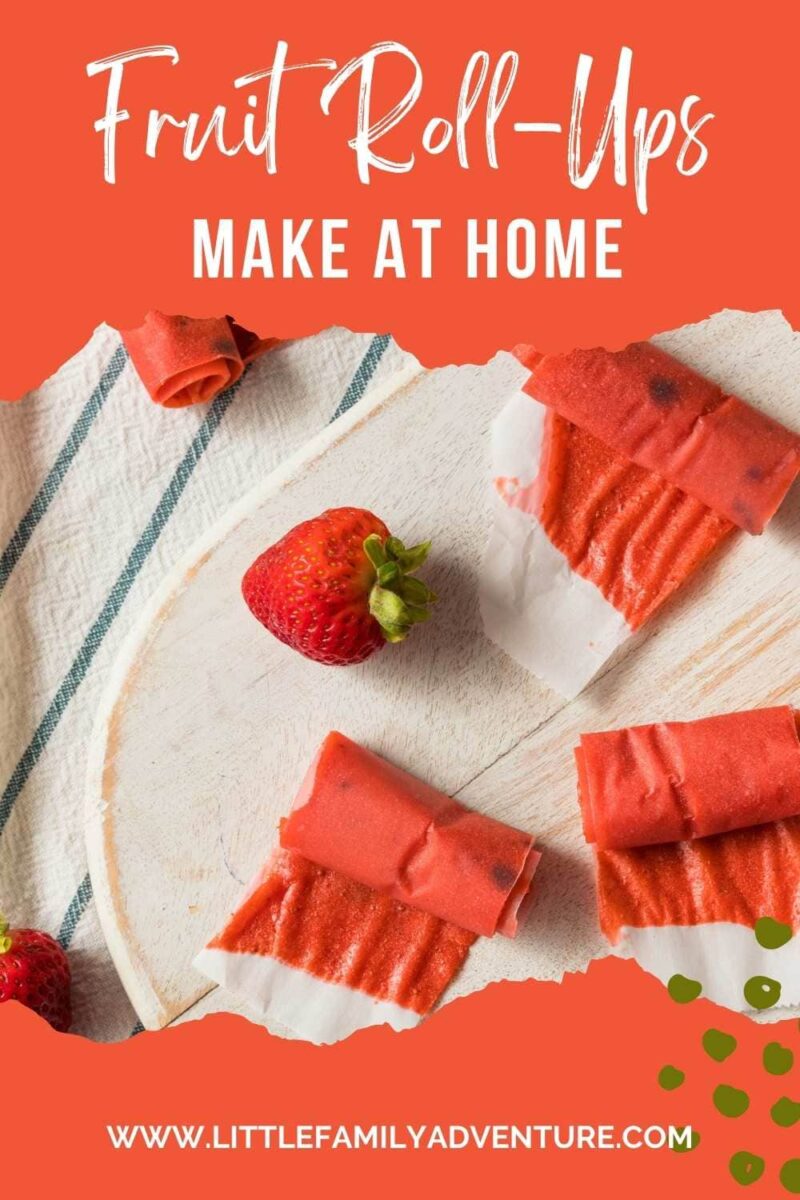 strawberry fruit rollups in wax paper on white platter