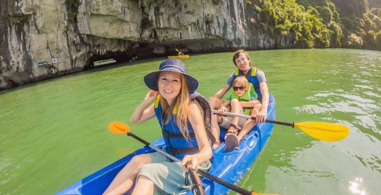 family in life vests on kayak
