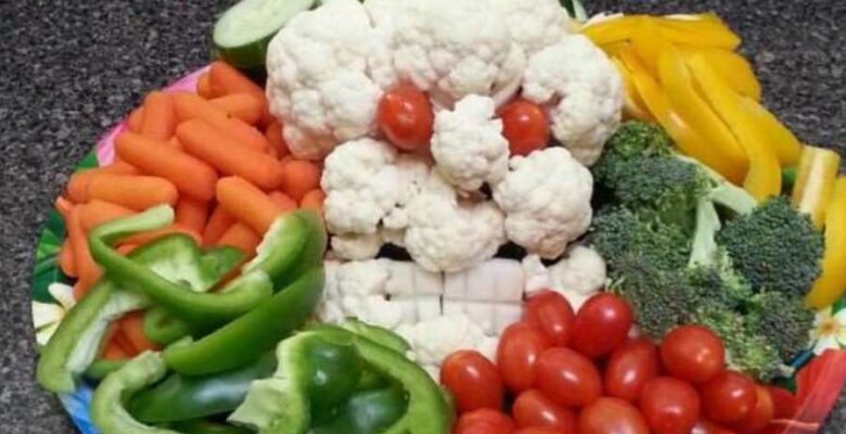 halloween themed veggie platter with cauliflower monster and other fresh veggies