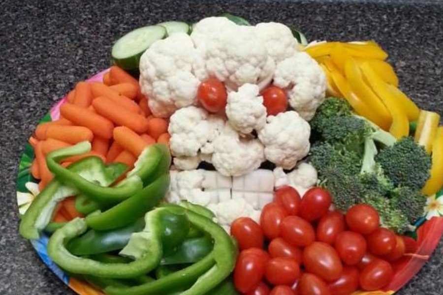 halloween themed veggie platter with cauliflower monster and other fresh veggies