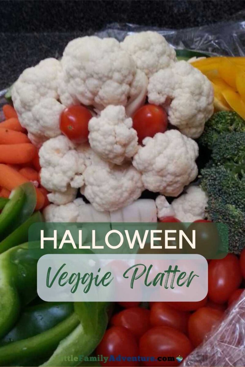 halloween veggie platter with cauliflower skeleton and fresh vegetables