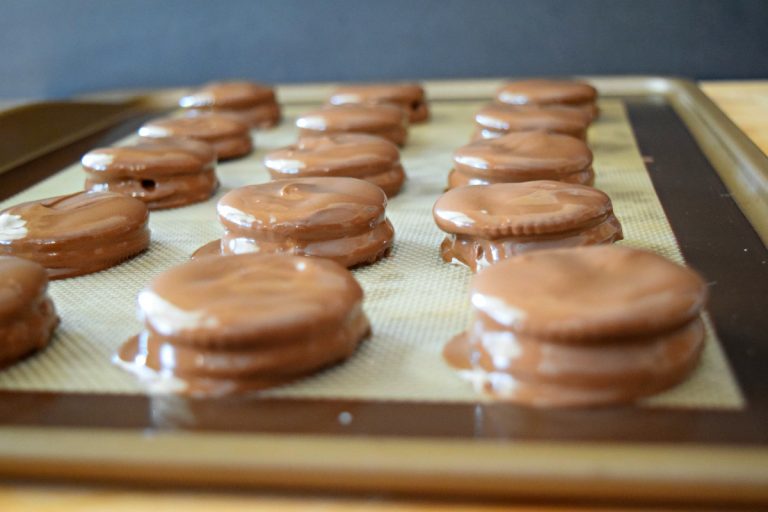 Chocolate Covered Ritz Crackers on a cookie sheet