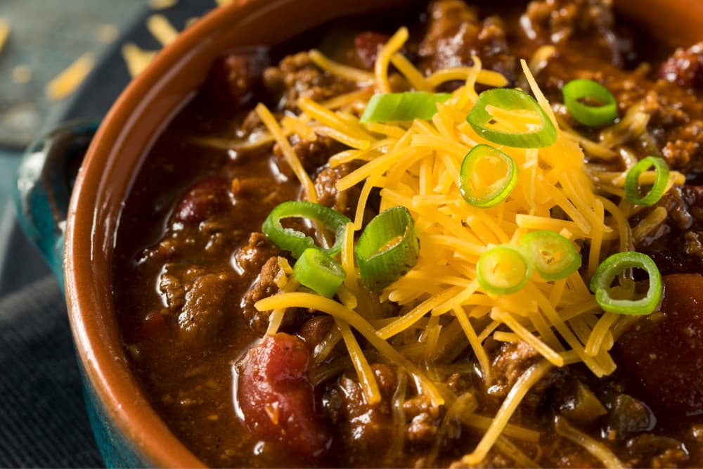 chili con carne and lentils in bowl