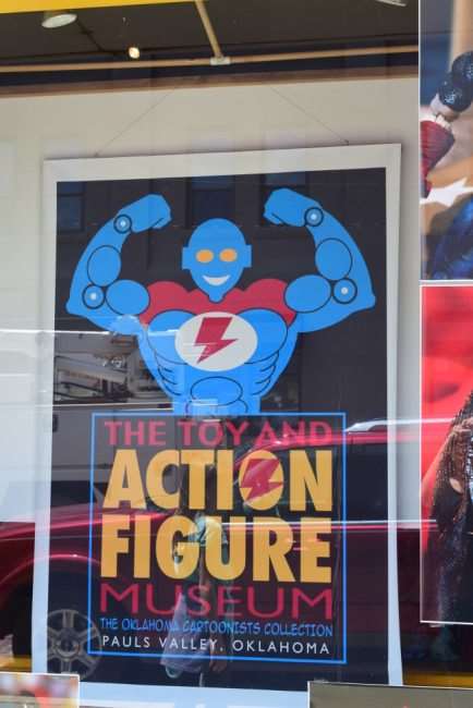toy and action figure museum sign