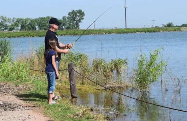 father and daughter fishing