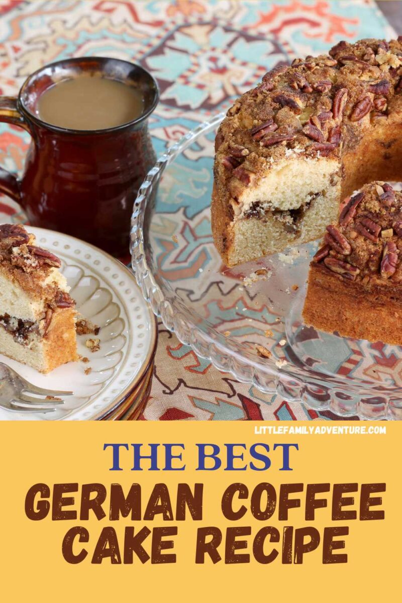 a german coffee cake recipe with pecans, a slice of coffee cake on a white plate with a brown ceramic mug of coffee in the background