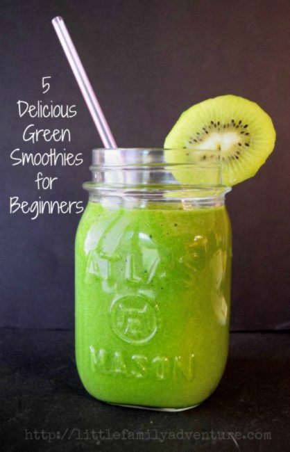 green smoothie in mason jar with straw