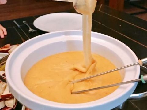 brad dipped in cheddar cheese fondue