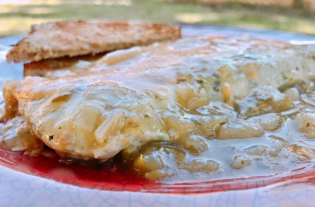 Omelete covered with green Chile