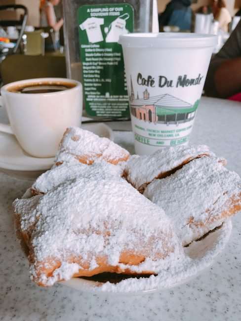 Cafe DuMonde Beignets and Chicory coffee are a MUST - Eat Your Way Around New Orleans and taste how diverse the city's culinary scene is. If you are traveling to NOLA check out these restaurants we visited on a recent trip and are sure to go back to again and again