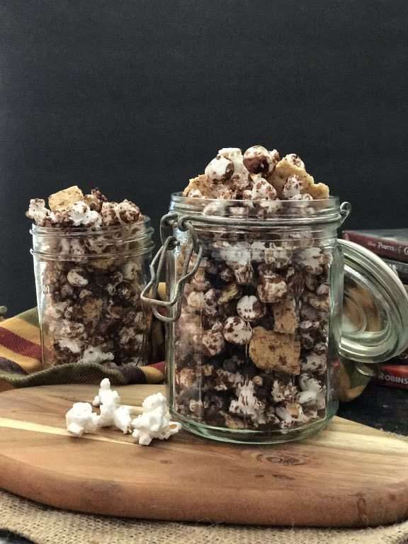 Easy S'mores Popcorn Snack mix - Popcorn drizzled with chocolate topped with more chocolate chips, mini marshmallows, and crushed graham crackers will rock your taste buds!