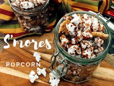 Easy S'mores Popcorn Snack mix - Popcorn drizzled with chocolate topped with more chocolate chips, mini marshmallows, and crushed graham crackers will rock your taste buds!