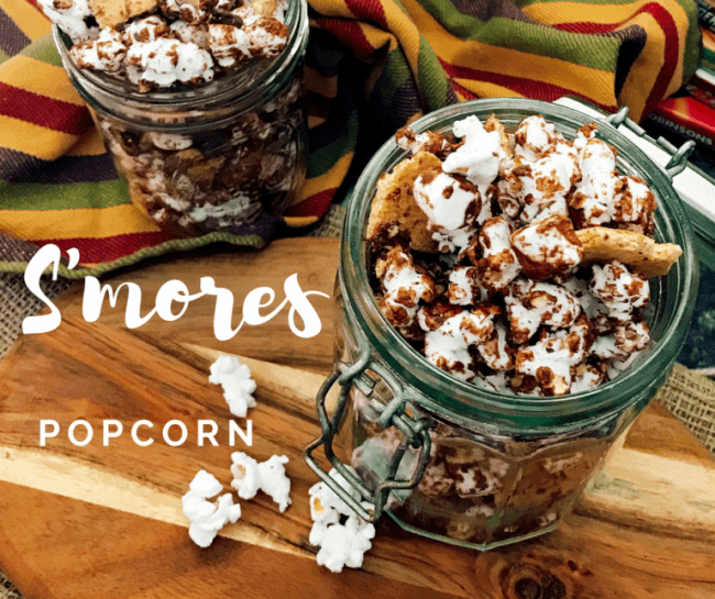 Easy S'mores Popcorn Snack mix - Popcorn drizzled with chocolate topped with more chocolate chips, mini marshmallows, and crushed graham crackers will rock your taste buds!