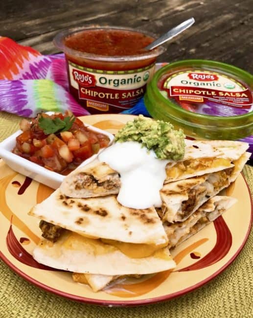 Sausage and Egg Breakfast Quesadillas - This is a delicious twist on breakfast burritos with mounds of ooey-gooey cheese, breakfast sausage, and scrambled eggs. Create these at home or while camping in a cast iron skillet. #breakfast #campingrecipe #campingbreakfast