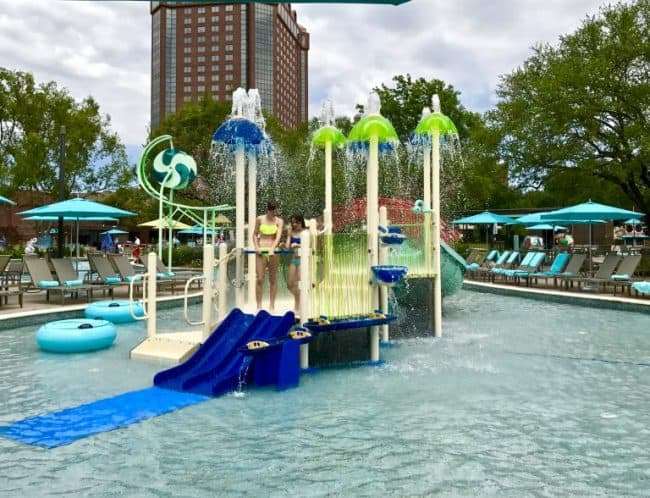 JadeWater at the Anatole -The Hilton at the Anatole is the perfect place to escape the Texas heat in Dallas. Their resort pool is a 2 acre summer oasis featuring a lazy river, water slides, pools, and a host of family-friendly activities.