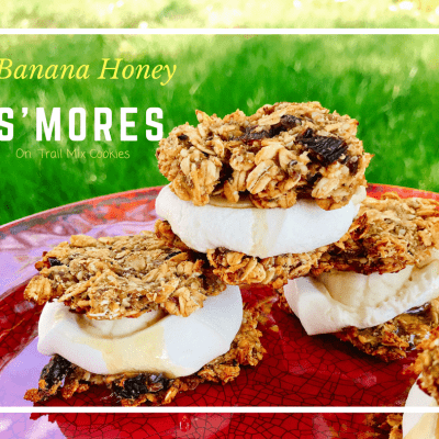 Instead of classic S'mores, mix things up with these gluten free Banana Honey S'mores on Trail Mix cookies. These camping snacks/desserts are vegan and made without refined sugar. Made with Wedderspoon Manuka Honey. Kids and adults eat them up.