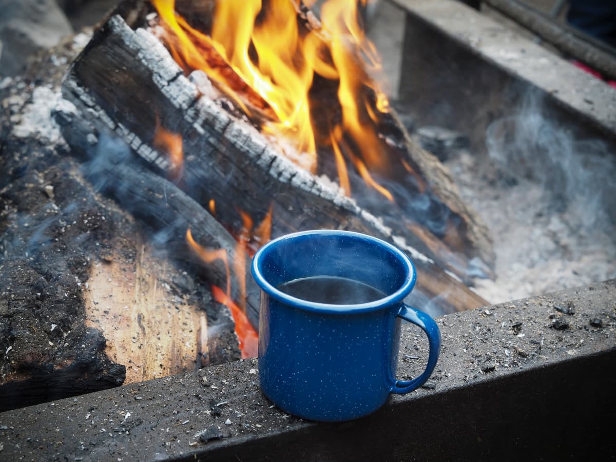 Coffee In A Moka Pot On A Camping Fire In The Morning Stock Photo