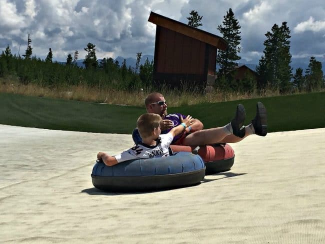 Summer tubing at YMCA of Rockies Snow Mountain Ranch. Just like snow tubing only in shorts. Fun for the whole family! Awesome mountain views and a magic carpet ride back up the hill to save your oxygen! Part of the YMCA Snow Mountain Ranch Family Fun Park. Come an play all day!