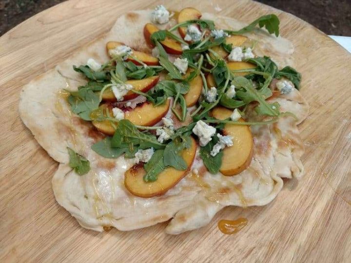 Peach & Honey Pizza made in an outdoor CampMaid Dutch Oven