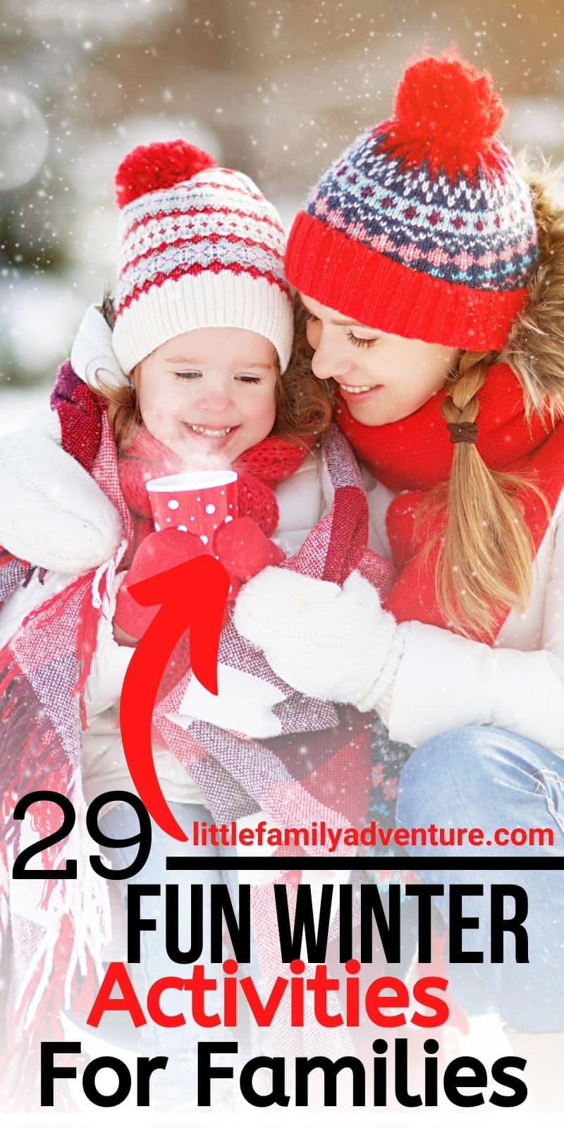 woman and child in snow enjoying hot beverage