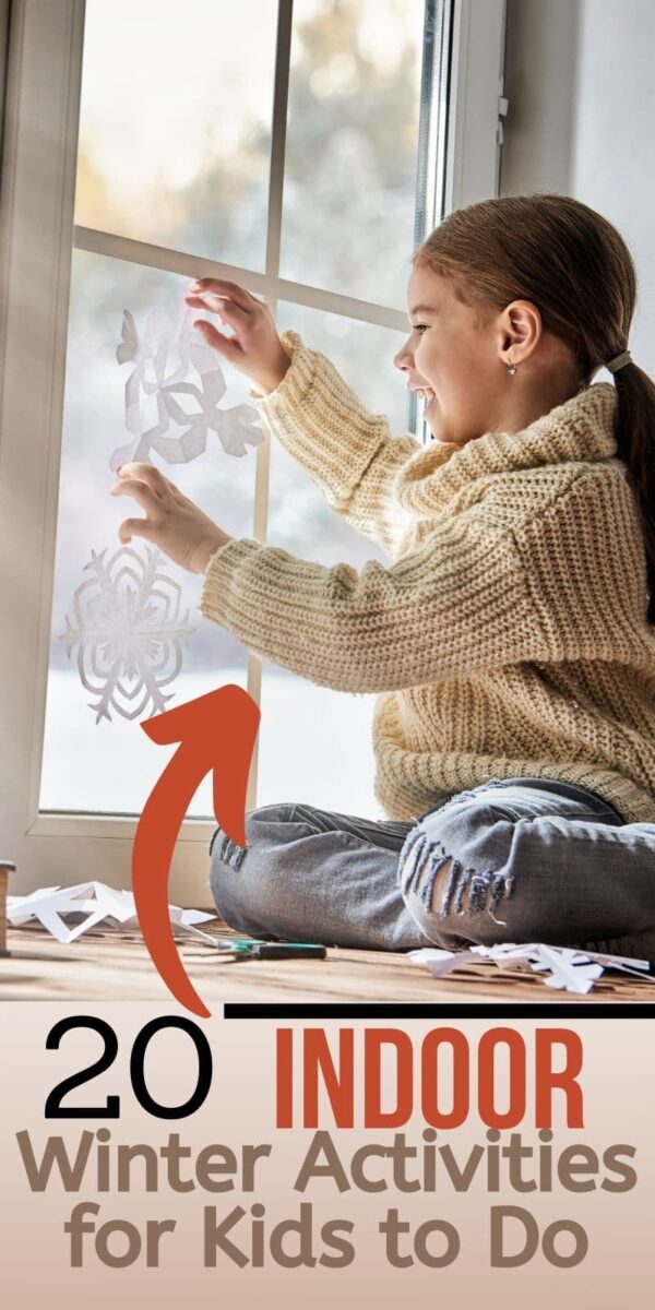 child making paper snowflakes