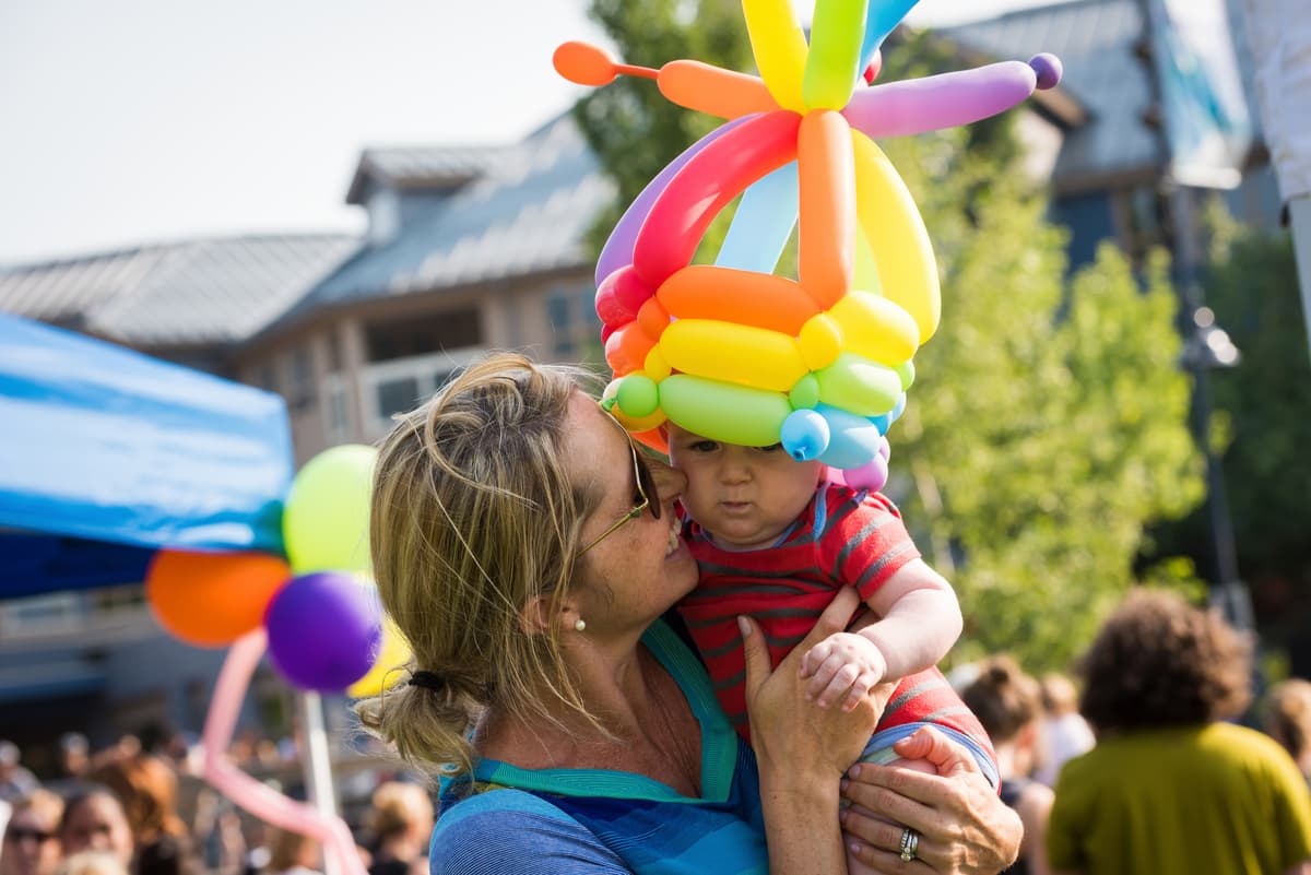 mother and infant with balloon hat