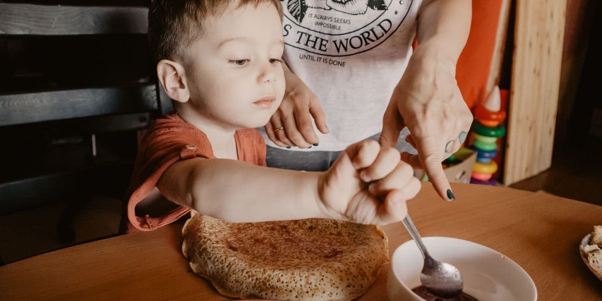 mom and boy cooking