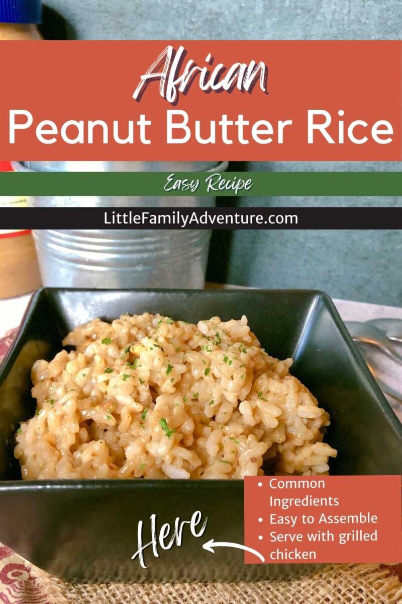 African peanut butter rice in black serving dish on table with silver galvanized steel bucket in background