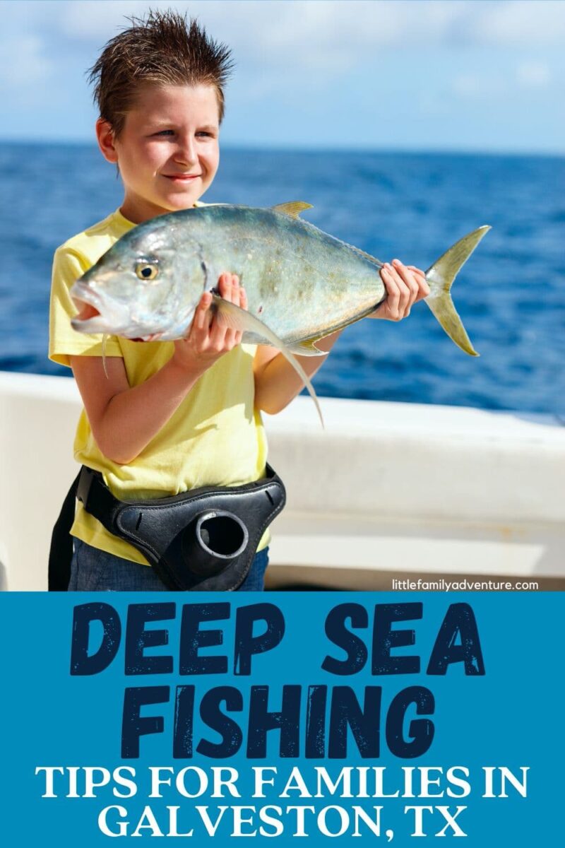 boy deep sea fising holding fish