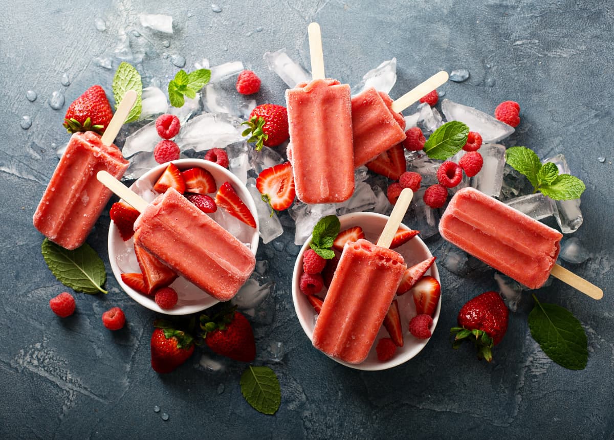 strawberry popsicles in bowls