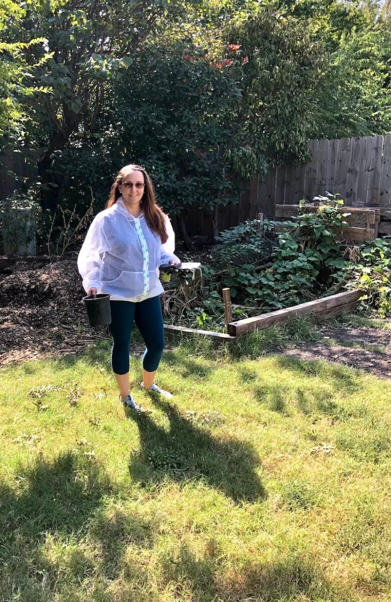 women standing/working in garden/backyard