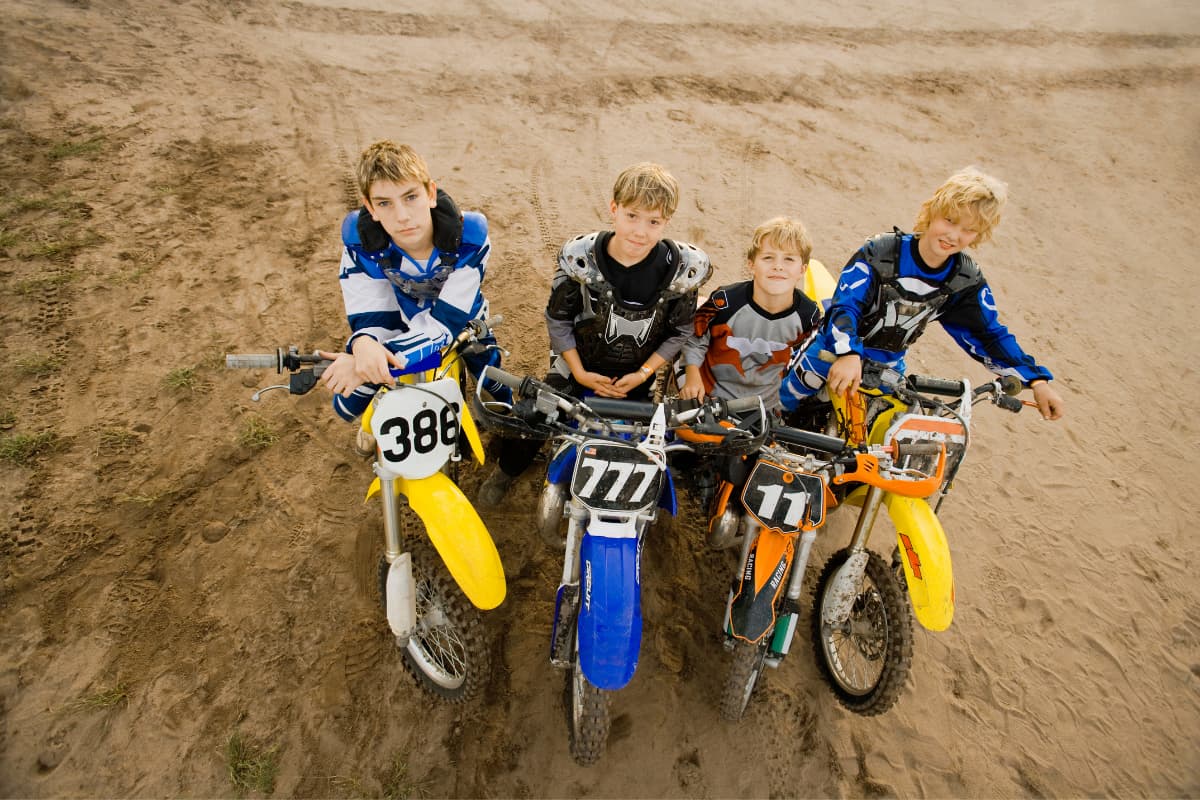 Boys riding cheap dirt bikes