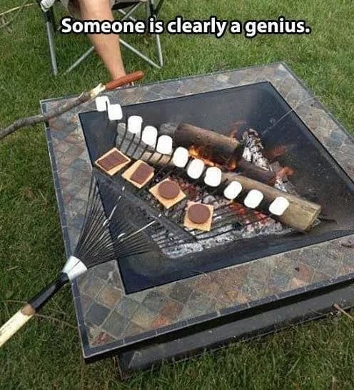 smores on a rack over campfire