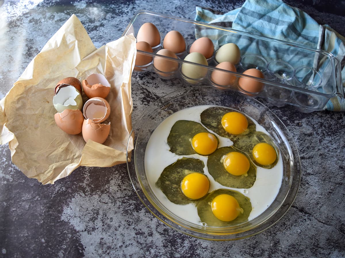 eggs and milk in shallow dish, eggs in cart, eggshells