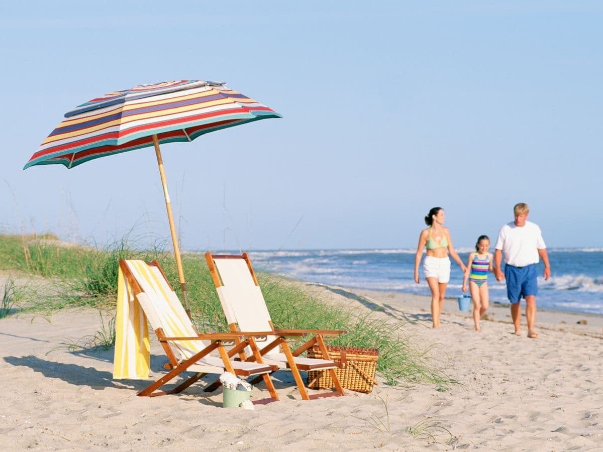 beach chairs, family walking on beach