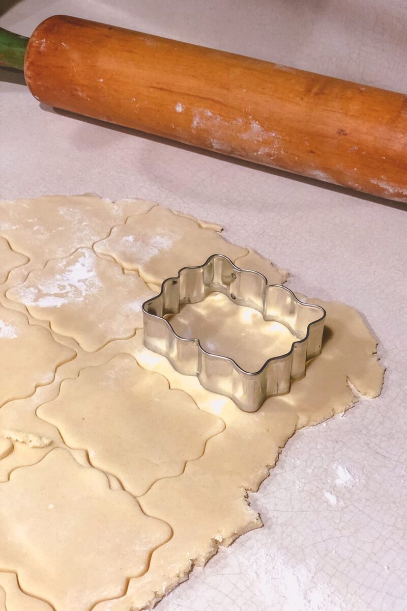 cookie cutter and rolling pin with dough