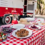 picnicn table with food in front of RV