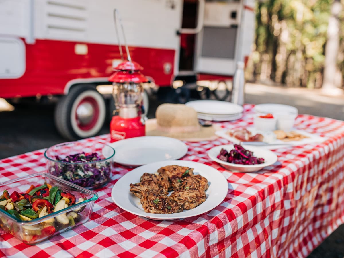 picnicn table with food in front of RV