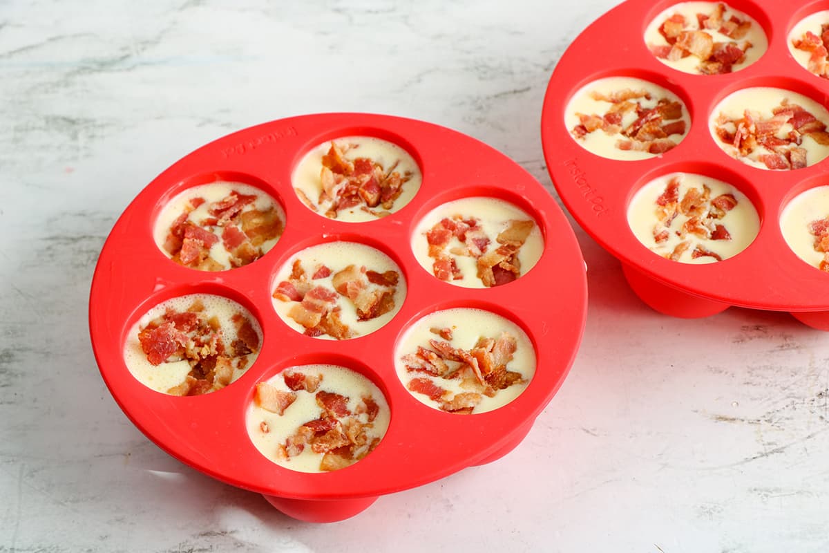 egg mixture and bacon in silicone mold