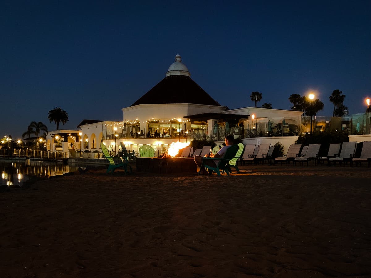 man sitting at bonfire