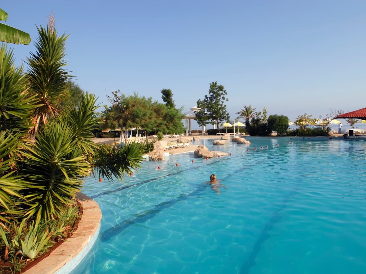 child swimming in pool