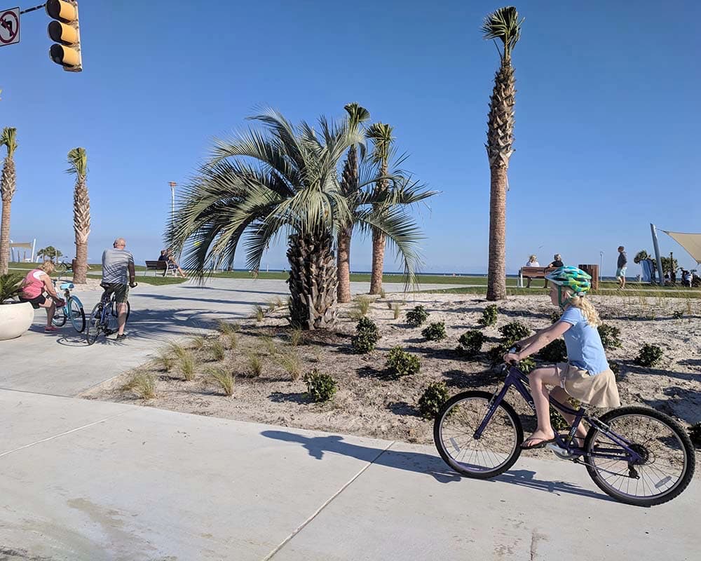 Gulf Shores girl cycling at beach