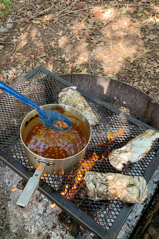 food cooking over camp fire