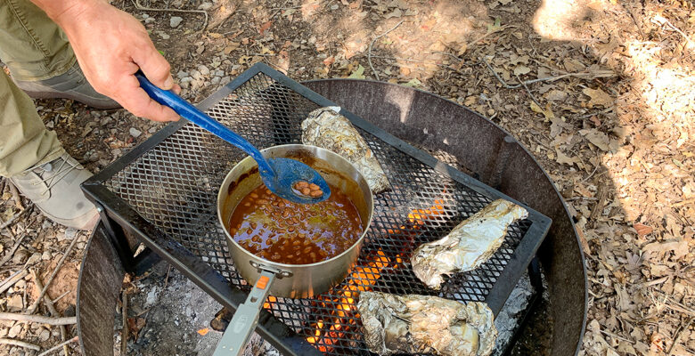 food cooking over camp fire